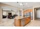 Open concept kitchen with large island and views to living room at 26822 W Oraibi Dr, Buckeye, AZ 85396