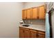 Laundry room features ample cabinetry and a convenient countertop at 26822 W Oraibi Dr, Buckeye, AZ 85396