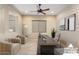Virtually staged home office with modern furniture and a large desk at 26822 W Oraibi Dr, Buckeye, AZ 85396