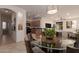 Modern dining area with a glass top table and view of kitchen at 298 E Diamond Trl, San Tan Valley, AZ 85143