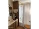 Clean bathroom with a tub shower and wood vanity at 4065 E University Dr # 140, Mesa, AZ 85205