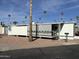 Mobile home with covered patio and side yard at 4065 E University Dr # 140, Mesa, AZ 85205