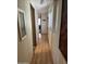 Long hallway with light wood flooring at 4065 E University Dr # 140, Mesa, AZ 85205