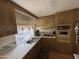 Galley kitchen with yellow oven and wood cabinets at 4065 E University Dr # 140, Mesa, AZ 85205