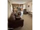Living room with comfortable seating and view into dining area at 4065 E University Dr # 140, Mesa, AZ 85205