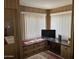Home office space with corner desk and tv at 4065 E University Dr # 140, Mesa, AZ 85205