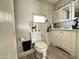 Clean bathroom with white vanity and updated flooring at 5201 W Camelback W Rd # D69, Phoenix, AZ 85031