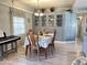 Bright dining room features a built-in hutch and wood table with seating for six at 5201 W Camelback W Rd # D69, Phoenix, AZ 85031
