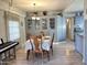 Bright dining room features a built-in hutch and wood table with seating for six at 5201 W Camelback W Rd # D69, Phoenix, AZ 85031
