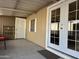 Covered patio with double doors leading into home at 5201 W Camelback W Rd # D69, Phoenix, AZ 85031