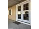 Covered patio with double doors leading into home at 5201 W Camelback W Rd # D69, Phoenix, AZ 85031