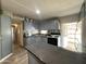Modern kitchen with gray cabinets, an island, and stainless steel appliances at 5201 W Camelback W Rd # D69, Phoenix, AZ 85031