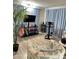 Living room with two armchairs, TV, and exercise bike at 5201 W Camelback W Rd # D69, Phoenix, AZ 85031