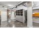Laundry room with ample storage and exposed brick wall at 914 E Osborn Rd # 202, Phoenix, AZ 85014