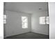Spacious bedroom with two windows and carpet at 9527 N 82Nd Ln, Peoria, AZ 85345