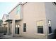 Tan two story house with covered patio and gravel yard at 9527 N 82Nd Ln, Peoria, AZ 85345