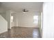 Bright living room featuring tile floors and two windows at 9527 N 82Nd Ln, Peoria, AZ 85345