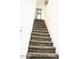 Carpeted staircase leading to the upper level at 9527 N 82Nd Ln, Peoria, AZ 85345