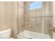 Bathroom with shower/tub combo and neutral tile at 10975 E Greenway Rd, Scottsdale, AZ 85255