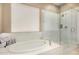 Spa-like bathroom with walk-in shower and soaking tub at 10975 E Greenway Rd, Scottsdale, AZ 85255