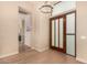 Bright entryway with hardwood floors and modern chandelier at 10975 E Greenway Rd, Scottsdale, AZ 85255
