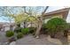 Single-story home with a two-car garage and mature desert landscaping at 10975 E Greenway Rd, Scottsdale, AZ 85255