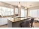 Modern kitchen featuring granite countertops and white cabinets at 10975 E Greenway Rd, Scottsdale, AZ 85255