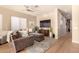 Cozy living room with hardwood floors and comfortable seating at 10975 E Greenway Rd, Scottsdale, AZ 85255