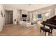 Living room with fireplace, hardwood floors, and plenty of natural light at 10975 E Greenway Rd, Scottsdale, AZ 85255