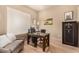 Home office features wood floors, built-in safe, and ample workspace at 10975 E Greenway Rd, Scottsdale, AZ 85255