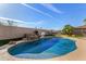 Sparkling blue pool with rock waterfall feature at 10975 E Greenway Rd, Scottsdale, AZ 85255