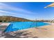 Community pool with mountain views and lounge chairs at 10975 E Greenway Rd, Scottsdale, AZ 85255