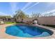 Resort-style pool with basketball hoop and grassy area at 10975 E Greenway Rd, Scottsdale, AZ 85255
