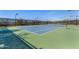Well-maintained tennis court with mountain backdrop at 10975 E Greenway Rd, Scottsdale, AZ 85255