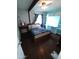 Bedroom with built-in shelving and dark wood flooring at 1217 E Fremont Dr, Tempe, AZ 85282