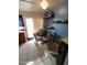 Small dining area with table and chairs, and wall shelving at 1217 E Fremont Dr, Tempe, AZ 85282