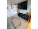 Living room featuring a large TV and coffee table at 1217 E Fremont Dr, Tempe, AZ 85282