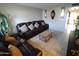 Living room with brown reclining sofa and coffee table at 1217 E Fremont Dr, Tempe, AZ 85282