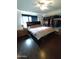 Spacious main bedroom with walk-in closet and dark wood furniture at 1217 E Fremont Dr, Tempe, AZ 85282
