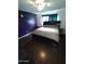 Main bedroom with dark wood furniture and laminate flooring at 1217 E Fremont Dr, Tempe, AZ 85282