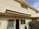 Private patio with retractable awning and sliding glass door access at 1217 E Fremont Dr, Tempe, AZ 85282