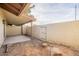 Small backyard with covered patio and access gate at 13316 N 26Th Dr, Phoenix, AZ 85029