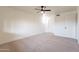 Bright bedroom with carpeted floor and ceiling fan at 13316 N 26Th Dr, Phoenix, AZ 85029
