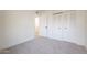 Spacious bedroom with double door closet and carpet flooring at 13316 N 26Th Dr, Phoenix, AZ 85029