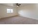 Bright bedroom with carpeted floor and window at 13316 N 26Th Dr, Phoenix, AZ 85029