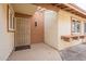 Front door entrance with security door and small planter at 13316 N 26Th Dr, Phoenix, AZ 85029