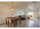 Open living room with grey sectional sofa and wood coffee table at 13316 N 26Th Dr, Phoenix, AZ 85029