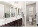 Clean bathroom with double vanity and shower at 19778 W Lincoln St, Buckeye, AZ 85326