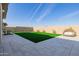 Spacious backyard with artificial turf and a relaxing daybed at 3538 E Hazeltine Way, Queen Creek, AZ 85142
