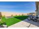 Backyard oasis with putting green, trampoline, and patio at 3538 E Hazeltine Way, Queen Creek, AZ 85142